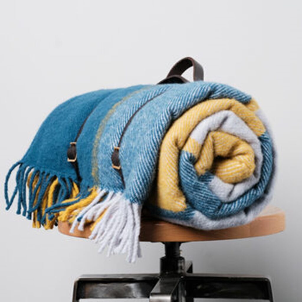 Blue and yellow soft blanket from Not The High Street