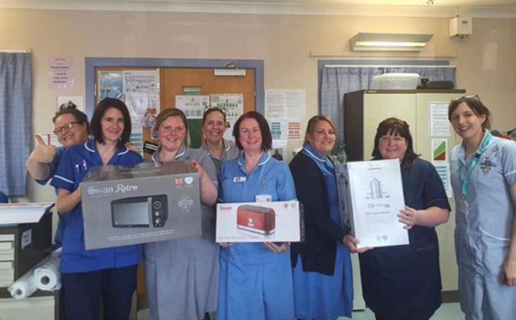 Gosport 2 District Nursing Team holding swan products