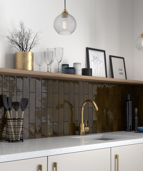 Kitchen sink area with wooden shelves decorated with Zellica Bronze Tiles from Topps Tiles