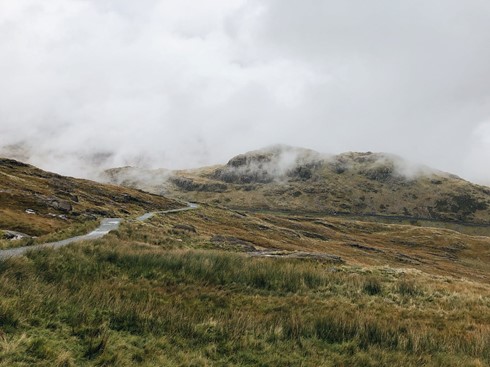 Photograph of Snowdonia National Park with a light fog over the hill