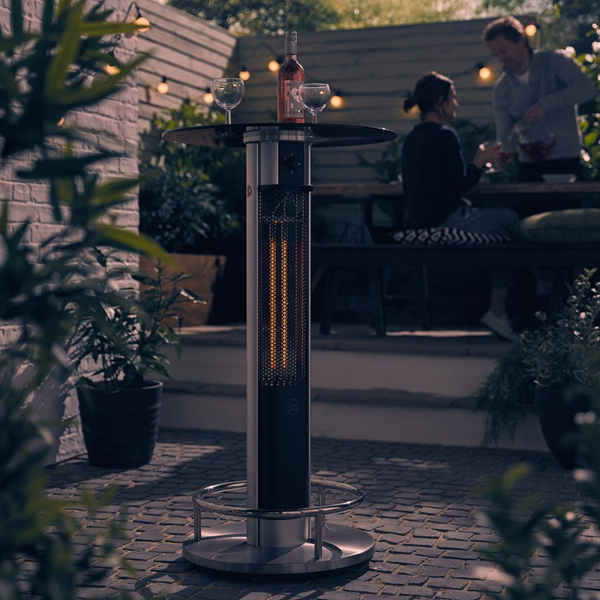 Photograph of Swan Bar Table Patio Heater on a stone patio