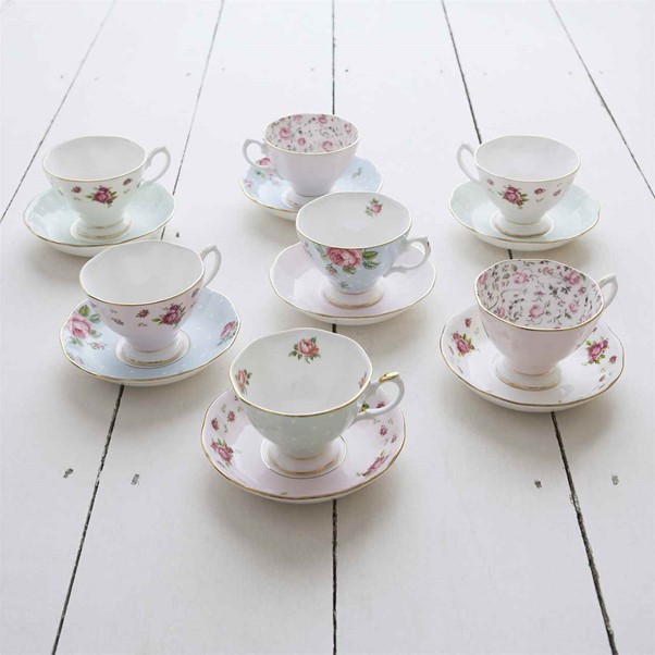 Photograph of a seven set of small white coloured floral teacups