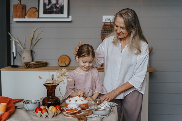 Photograph of grandmother and granddaughter baking a carrot cake for Easter