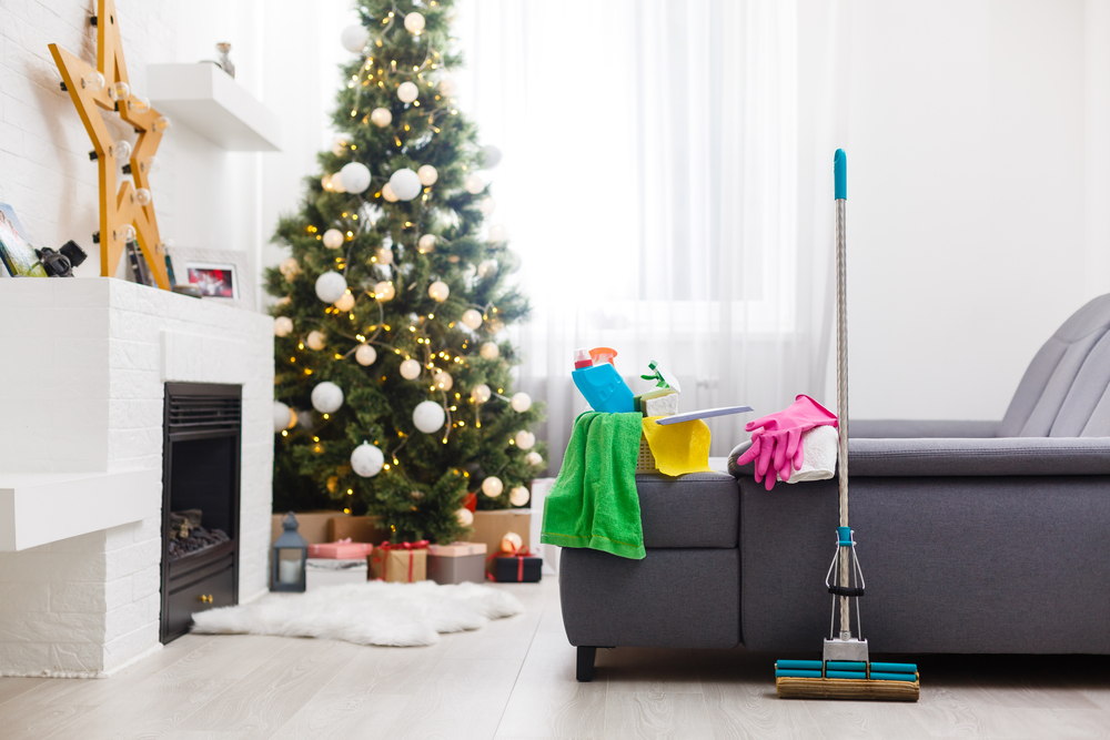 Photograph of a living room with a christmas tree in the background