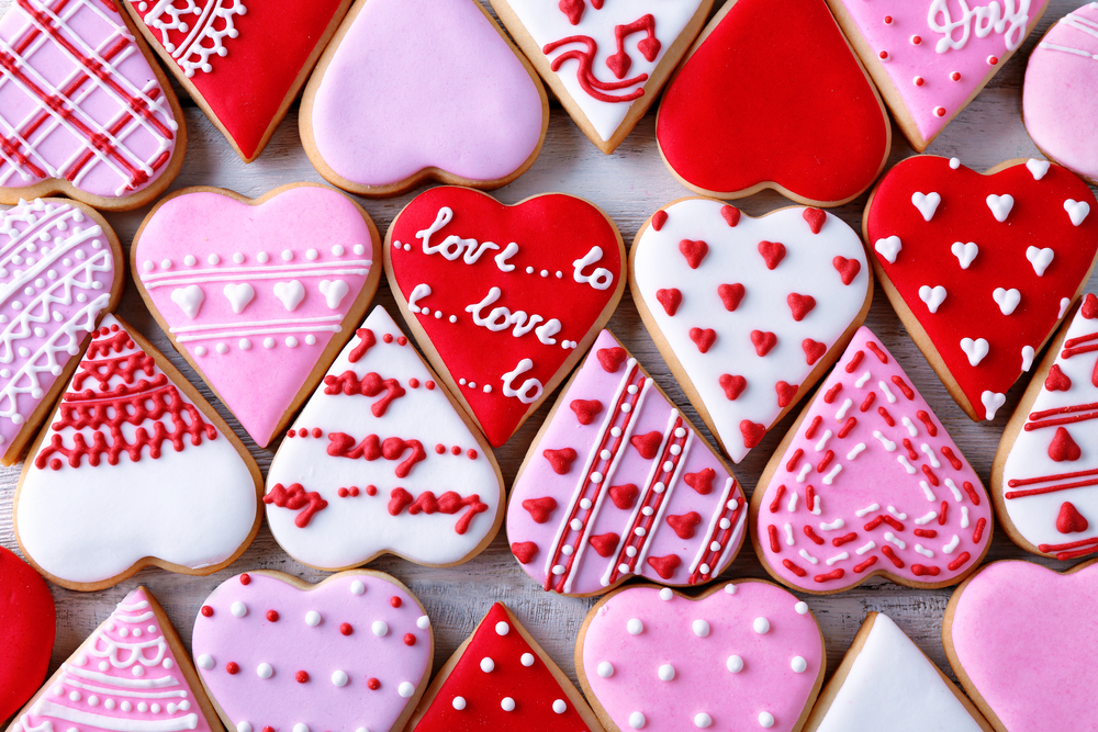 Image of heart shaped cookies decorated with pink, red and white icing