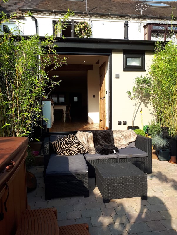 Photograph of black furniture and outdoor patio space in Stoke-on-trent home
