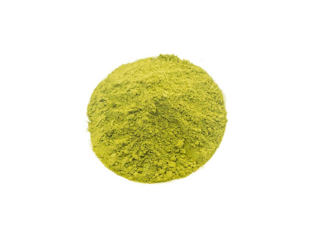 Pile of cooking/culinary grade matcha against a white background