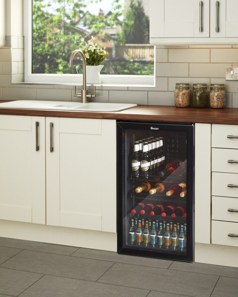 Swan Wine Cooler in white fitted kitchen with wooden countertops