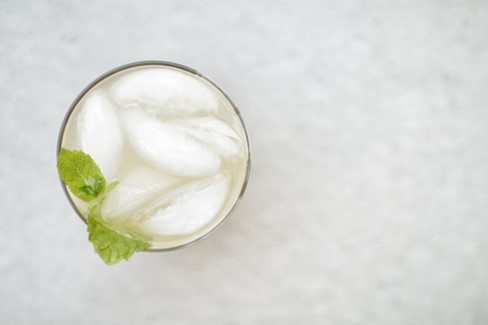 Birdseye view of a classic frozen margarita against a white background