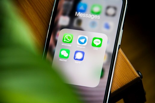 Close up of a phone screen with app icons for Whatsapp, Telegram, LINE, WeChat and Signal