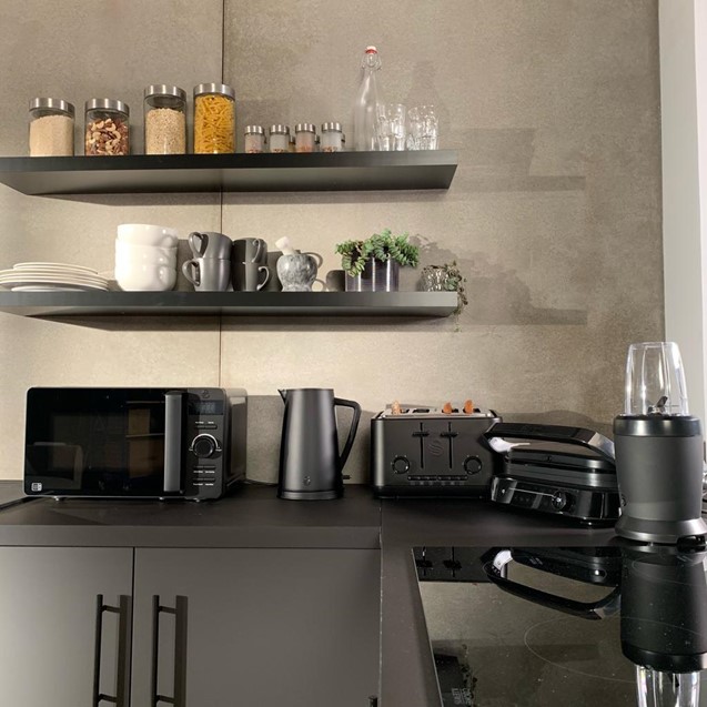Grey and black fitted kitchen with the Stealth Microwave, Stealth Kettle, Stealth 4 Slice Toaster, Stealth Smart Grill and Stealth Personal Blender on the black countertop
