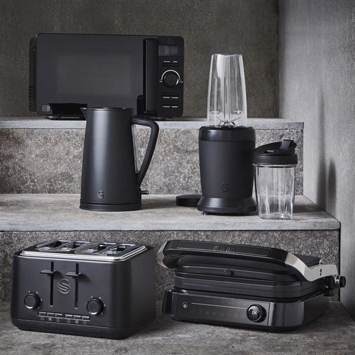 The Stealth Microwave, Stealth Kettle, Stealth Personal Blender, Stealth four slice toaster and Stealth Smart Grill on marble grey steps