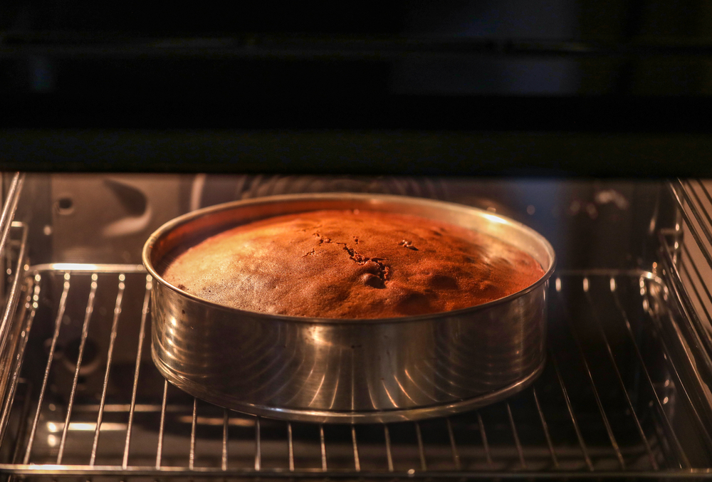 A cake being baked in the oven.
