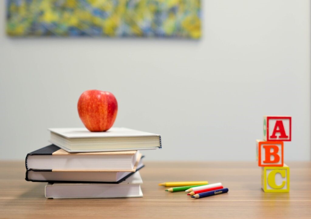 An apple sitting on top of books to showcase going back to school. 