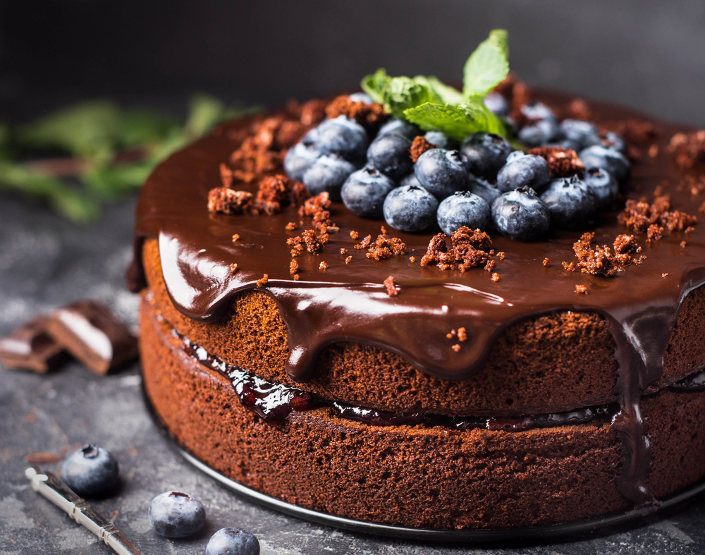 A chocolate cake with blueberries on the top