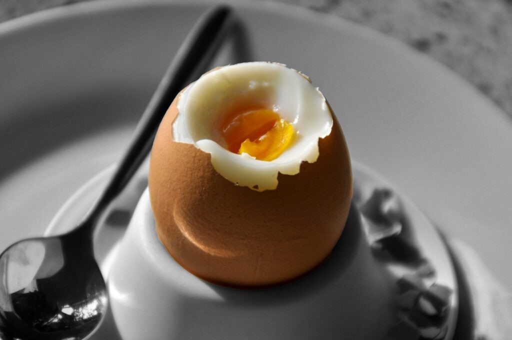 A boiled egg in an egg cup.