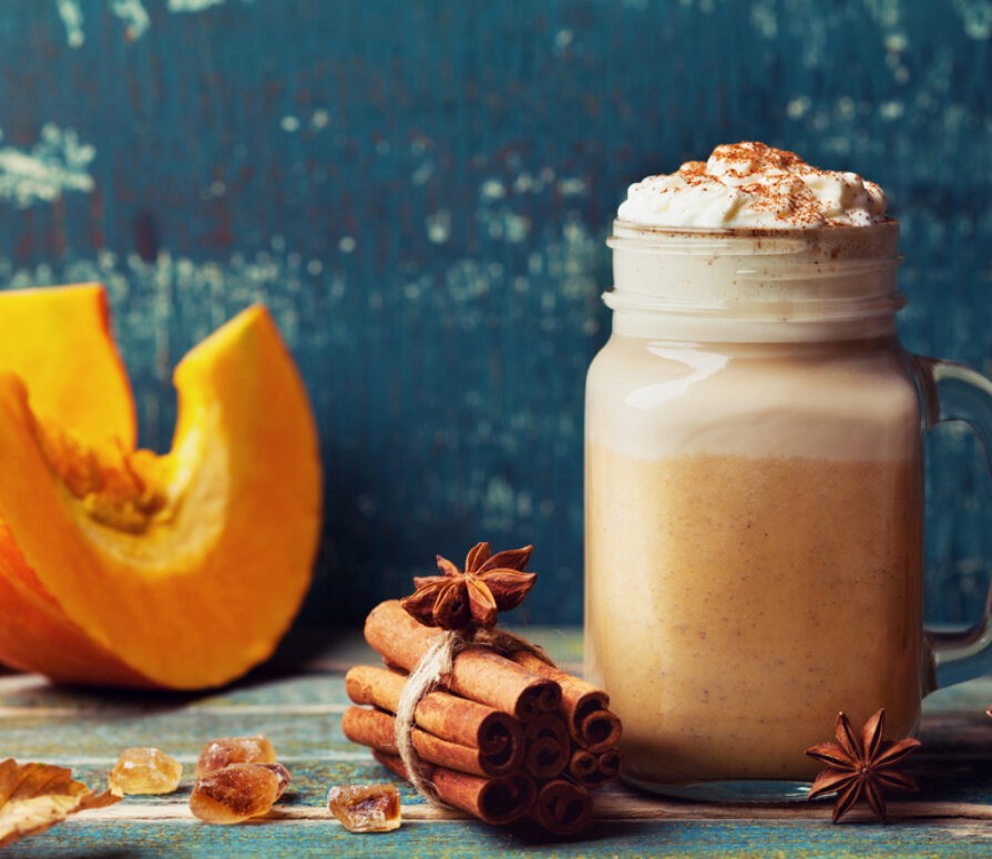 A wooden table with a delicious smoothie for the autumn. 
