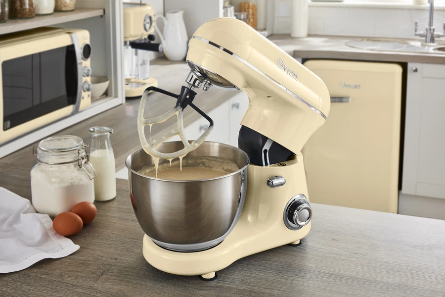 Image of the Swan Retro Stand Mixer in cream with mixed batter inside the stainless steel bowl.