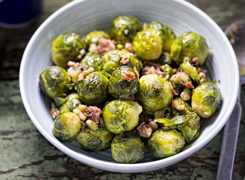 Image of a bowl of sprouts with pancetta.