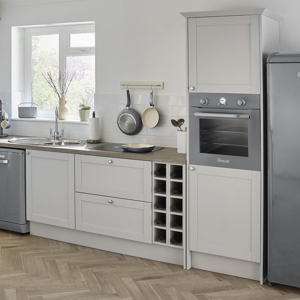 Swan Retro Grey fridge, Retro pan set and dishwasher in a light white kitchen