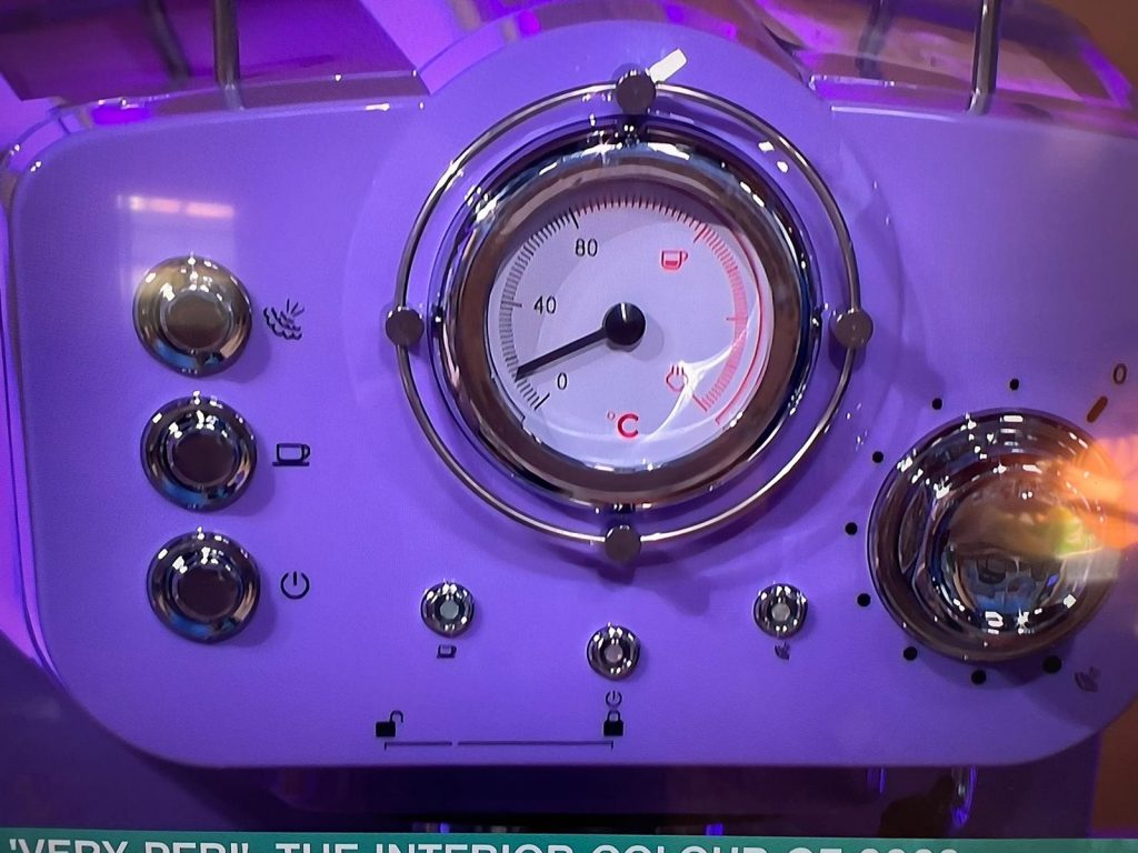 Close up of the very peri Swan retro manual espresso machine in purple