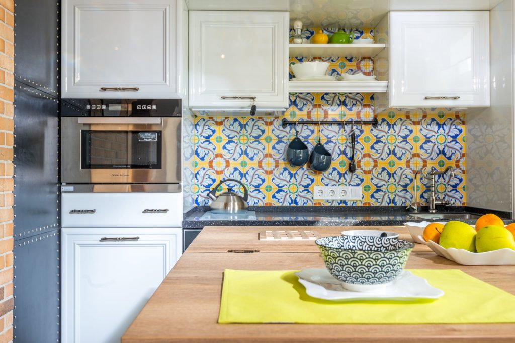 A colourful kitchen with patterned tiles