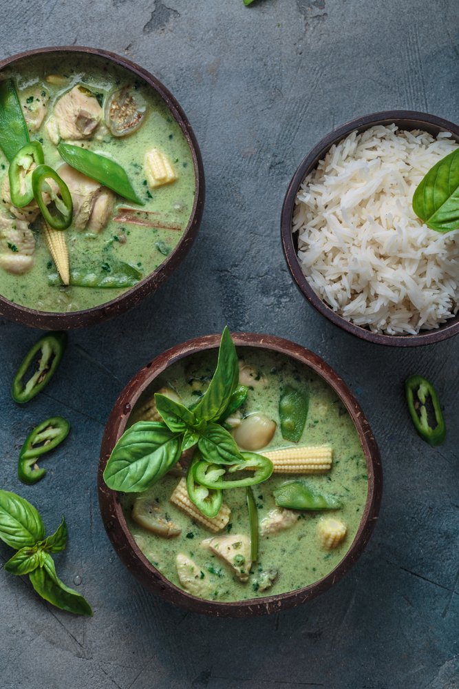 Thai green curry in wooden bowls for mangetout recipes blog.