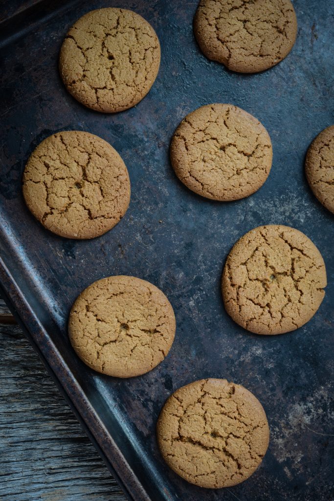 Gingersnap sugar-free biscuits on baking tray.