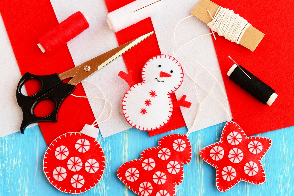 handmade christmas decorations being made out of coloured felt
